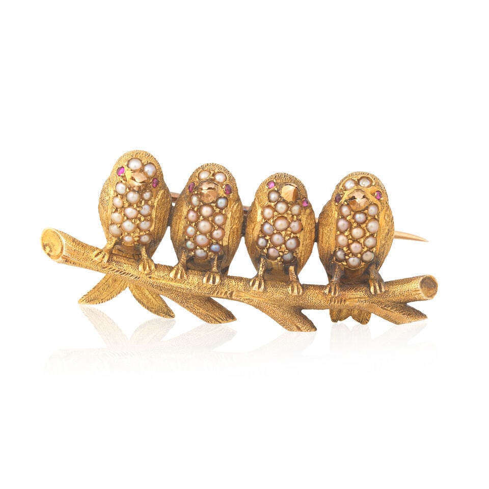 SEED PEARL AND PINK SAPPHIRE-SET BIRD BROOCH: SEED PEARL AND PINK SAPPHIRE-SET BIRD BROOCH Four birds on a branch Half seed pearls Pink sapphire cabochons Length 4.2cm Weight approx. 10.5g Footnotes: OVERALL CONDITION Light surface wear to unhall