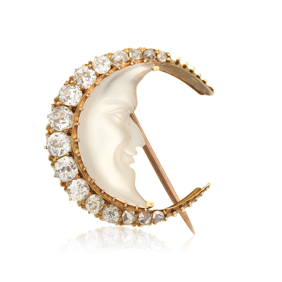DIAMOND AND ROCK CRYSTAL-SET 'MAN IN THE MOON' BROOCH, CIRCA 1900: DIAMOND AND ROCK CRYSTAL-SET 'MAN IN THE MOON' BROOCH, CIRCA 1900 Old brilliant, single and rose-cut diamonds approx. 0.75ct total Carved rock crystal Length approx. 2.1cm Weight approx. 4.5g Footnote