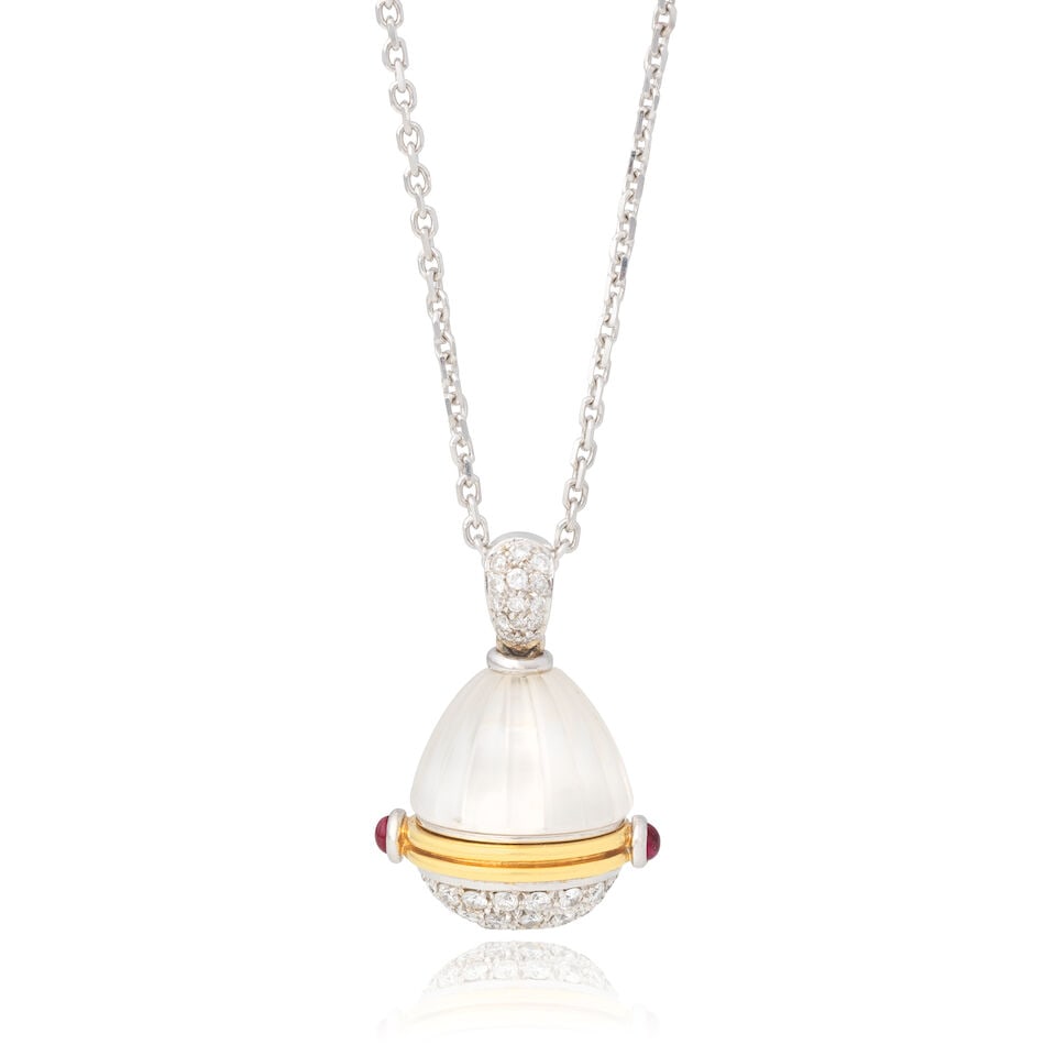 DIAMOND, RUBY AND ROCK CRYSTAL EGG LOCKET NECKLACE: DIAMOND, RUBY AND ROCK CRYSTAL EGG LOCKET NECKLACE Brilliant-cut diamonds approx. 0.80ct total Ruby cabochons Carved rock crystal Pendant length including bale 2.4cm, necklace length 70.5cm Weight