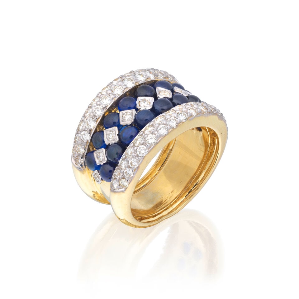SAPPHIRE AND DIAMOND DRESS RING: SAPPHIRE AND DIAMOND DRESS RING Brilliant-cut diamonds approx. 0.65ct total Sapphire cabochons Ring size approx. O½ Weight approx. 13.5g Footnotes: OVERALL CONDITION Light surface wear to unhallm