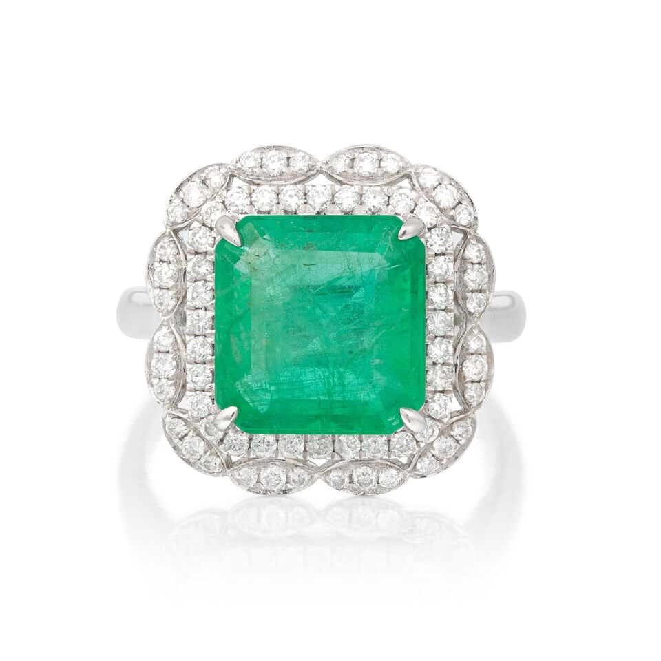 EMERALD AND DIAMOND RING: EMERALD AND DIAMOND RING Octagonal step-cut emerald Brilliant-cut diamonds approx. 0.40ct total Ring size approx. N Weight approx. 7.5g Footnotes: OVERALL CONDITION Negligible surface wear to unhallma