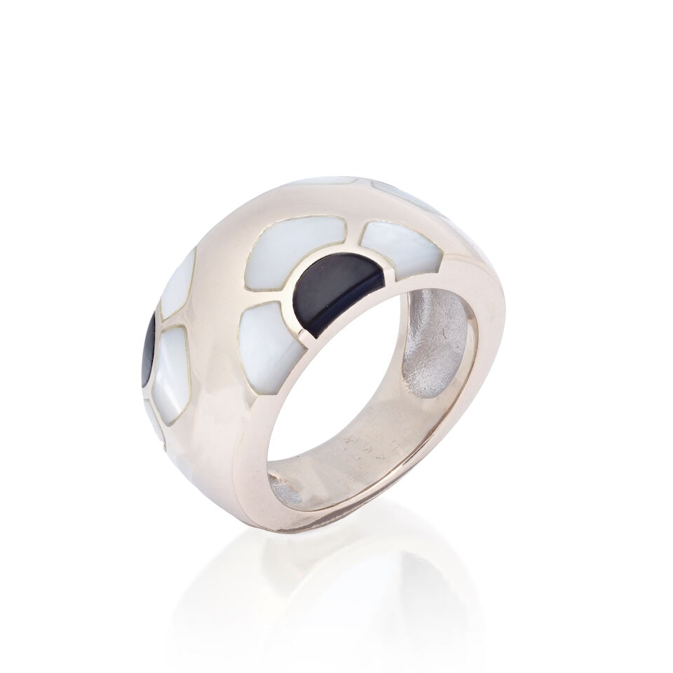 VAN CLEEF & ARPELS: MOTHER-OF-PEARL RING: VAN CLEEF & ARPELS: MOTHER-OF-PEARL RING Mother of pearl inlays Signed VCA, numbered BF3105, French assay mark Ring size approx. L (leading edge) Weight approx. 16.0g Footnotes: Please note this lot w