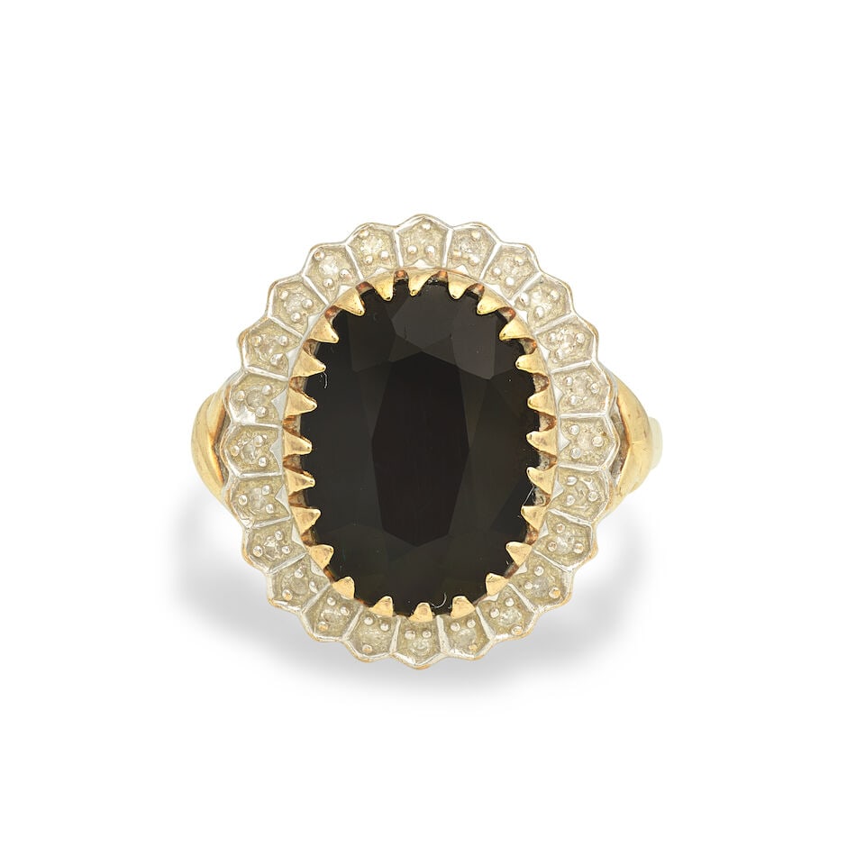 RETAILED BY BOODLES & DUNTHORNE: SAPPHIRE AND DIAMOND CLUSTER RING: RETAILED BY BOODLES & DUNTHORNE: SAPPHIRE AND DIAMOND CLUSTER RING Oval-cut sapphire, approx. 6.10cts Single-cut diamonds 9 carat gold Maker's mark PJ, UK hallmark, European convention mark Ring size