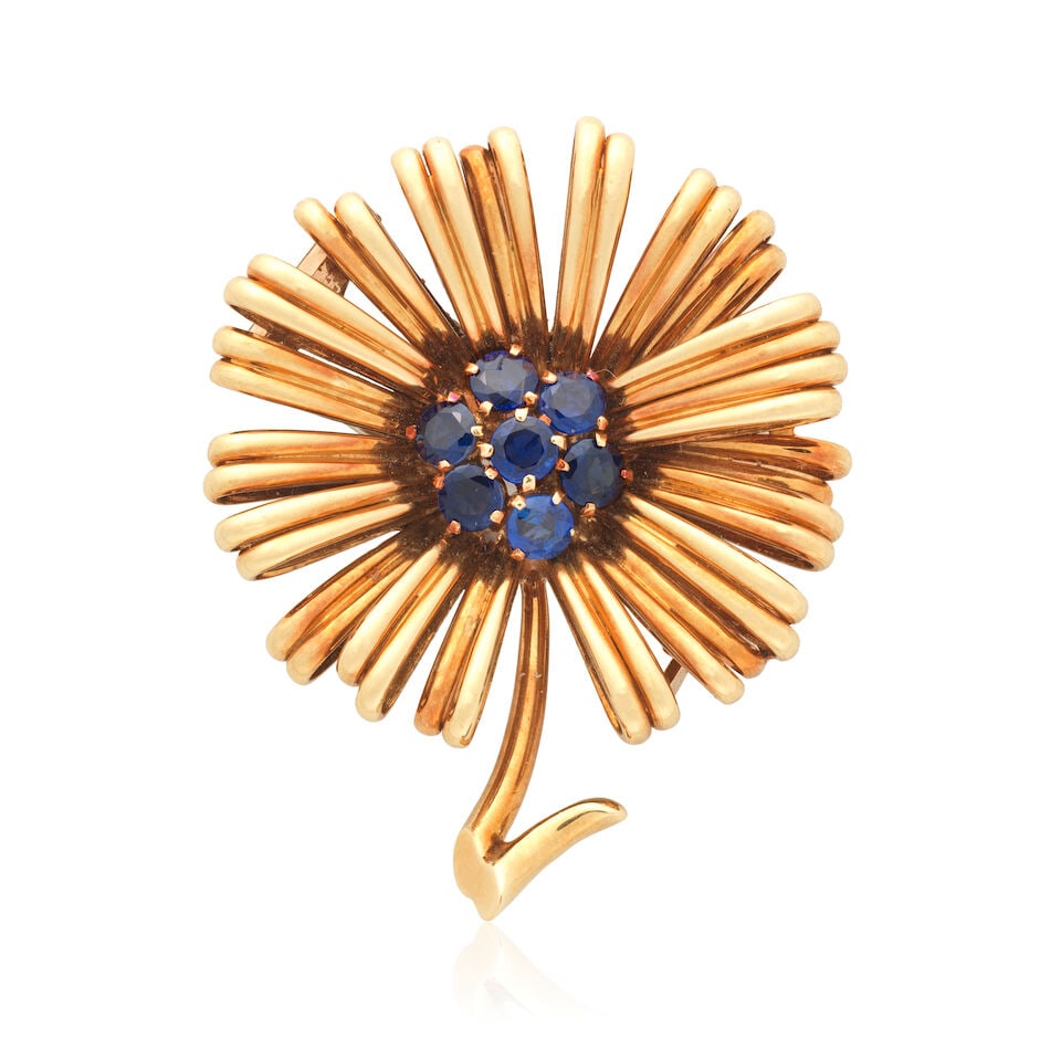 SAPPHIRE FLOWER BROOCH, CIRCA 1960: SAPPHIRE FLOWER BROOCH, CIRCA 1960 Circular-cut sapphires Length 3.7cm Weight approx. 16.0g Footnotes: For a very comparable brooch by Van Cleef & Arpels see Bonhams, Salon Jewelry, Los Angeles, 21st