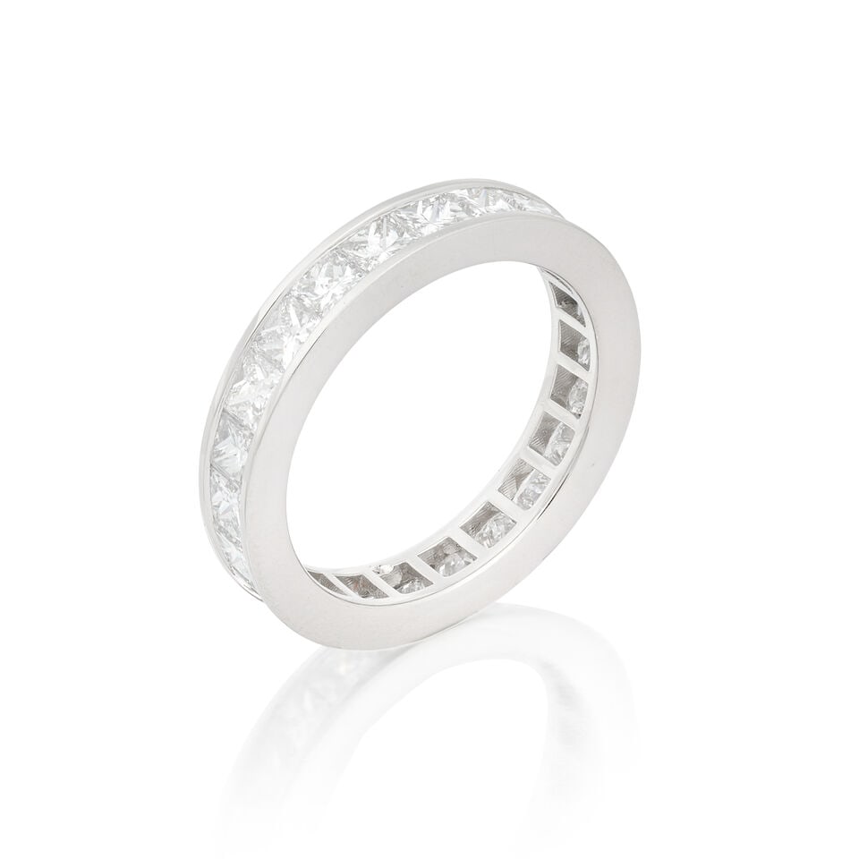 DIAMOND ETERNITY RING: DIAMOND ETERNITY RING Princess-cut diamonds 3.31 carats total Ring size approx. N Weight approx. 5.0g Footnotes: OVERALL CONDITION Negligible surface wear to unhallmarked metal testing as platinum. DI