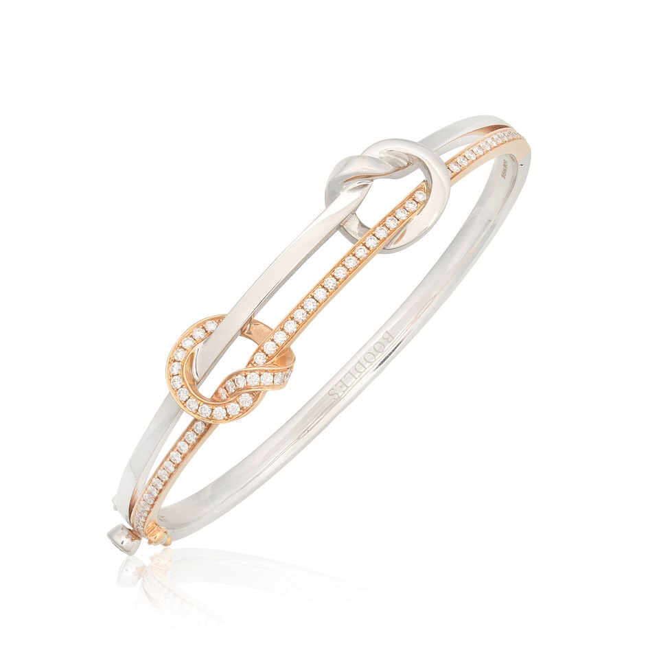 BOODLES: DIAMOND-SET 'KNOT' BANGLE, 2017: BOODLES: DIAMOND-SET 'KNOT' BANGLE, 2017 Brilliant-cut diamonds approx. 0.95ct total 18 carat gold Signed Boodles, numbered 1122170388, maker's mark, London hallmark Inner circumference approx.