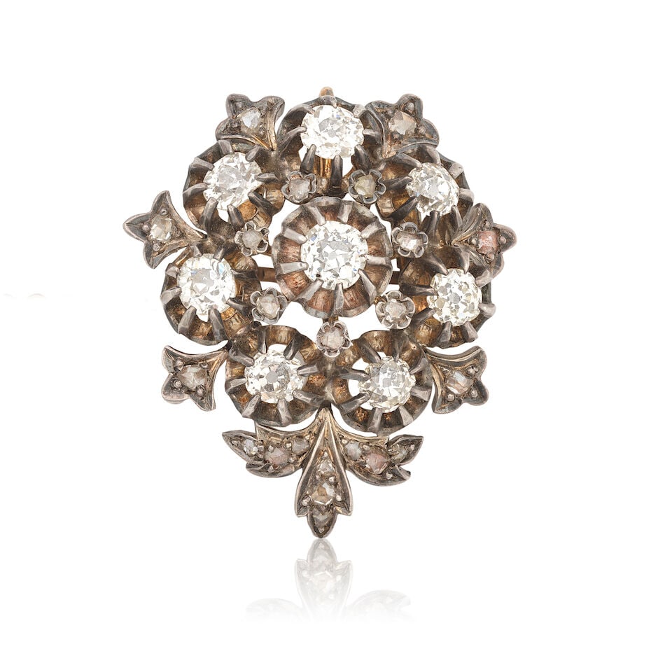 DIAMOND-SET BROOCH/PENDANT, CIRCA 1870: DIAMOND-SET BROOCH/PENDANT, CIRCA 1870 Old brilliant and rose-cut diamonds approx. 1.50cts total Mounted in silver and gold Length approx. 3.0cm Weight approx. 9.0g Footnotes: OVERALL CONDITION Light
