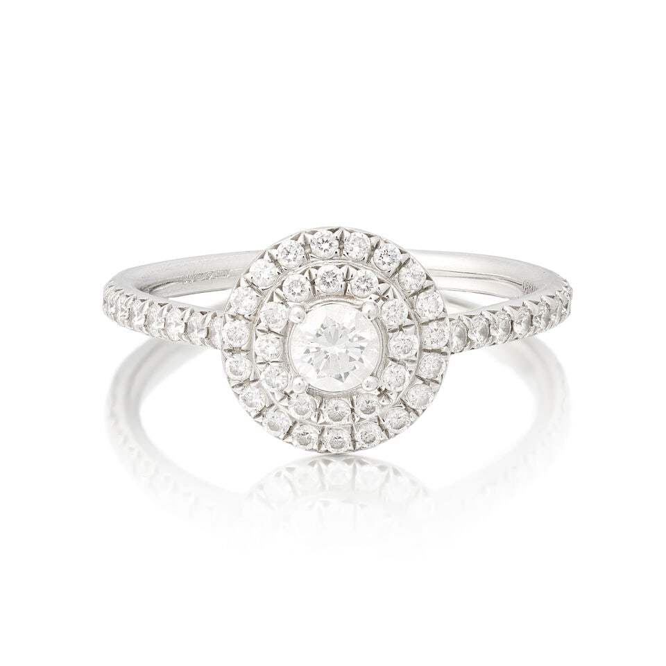 TIFFANY: DIAMOND RING: TIFFANY: DIAMOND RING Brilliant-cut diamonds, principal diamond approx. 0.15ct, remaining diamonds approx. 0.50ct total Platinum Signed Tiffany&Co., maker's mark T&Co, London hallmark Ring size