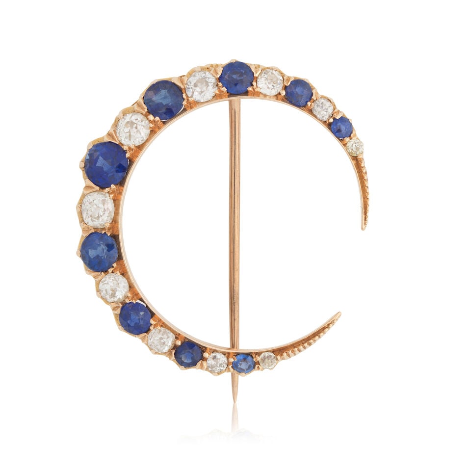 SAPPHIRE AND DIAMOND CRESCENT MOON BROOCH, CIRCA 1880: SAPPHIRE AND DIAMOND CRESCENT MOON BROOCH, CIRCA 1880 Circular-cut sapphires Old brilliant-cut diamonds approx. 0.75ct total Mounted in gold Length 3.2cm Weight approx. 5.5g Footnotes: OVERALL CONDITI