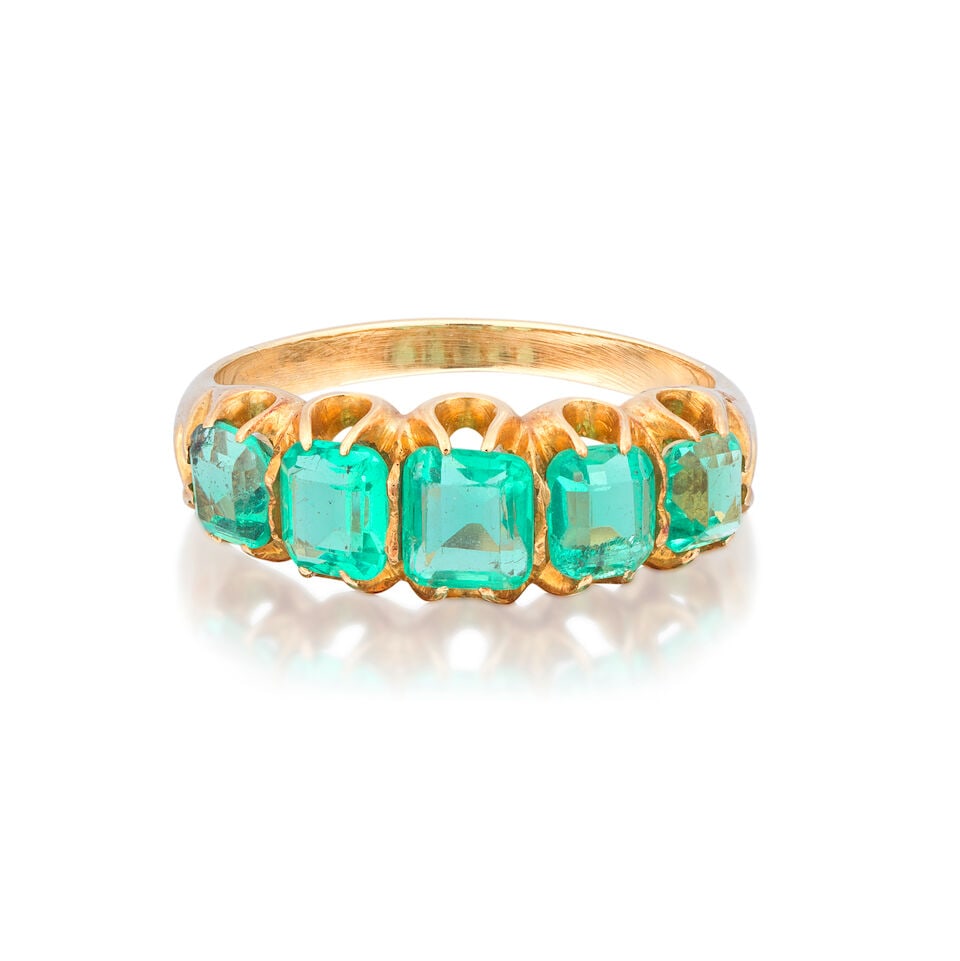 EMERALD FIVE-STONE RING: EMERALD FIVE-STONE RING Octagonal step-cut emeralds Ring size approx. M½ Weight approx. 3.5g Footnotes: OVERALL CONDITION Some wear to unhallmarked metal testing as 16kt gold. Some thinning to