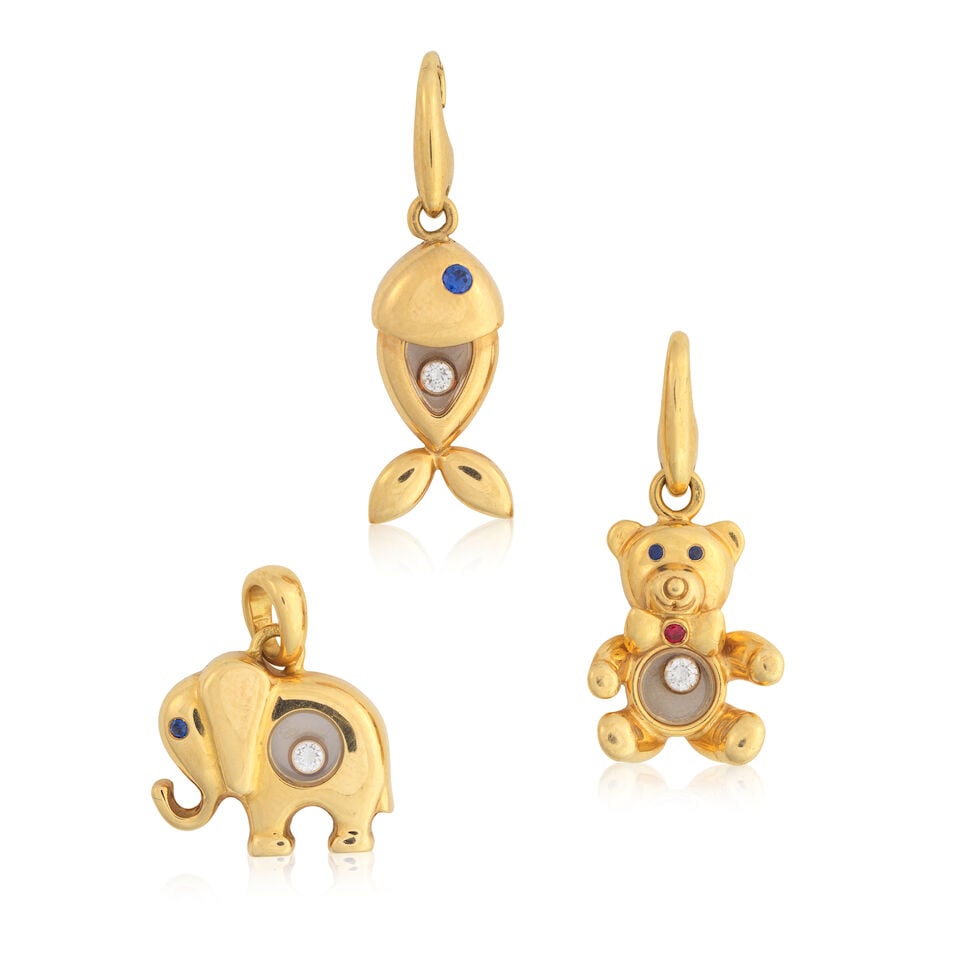 CHOPARD: THREE GEM-SET 'HAPPY DIAMONDS' CHARMS: CHOPARD: THREE GEM-SET 'HAPPY DIAMONDS' CHARMS A fish, elephant and teddy bear Brilliant-cut diamonds Circular-cut ruby Circular-cut sapphires Signed Chopard, numbered Longest length 3.0cm, shortest