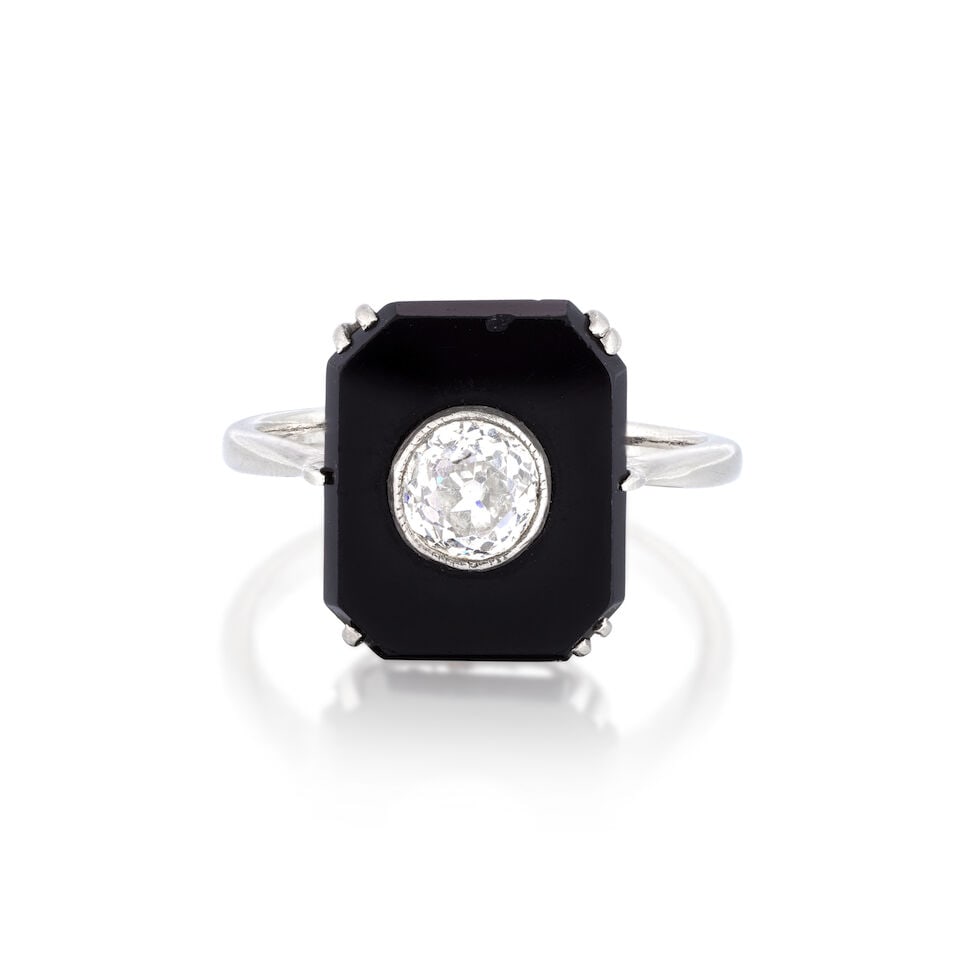 ONYX AND DIAMOND RING: ONYX AND DIAMOND RING Old brilliant-cut diamond approx. 0.40ct total Onyx plaque Ring size approx. K Weight approx. 3.5g Footnotes: OVERALL CONDITION Some surface wear to unhallmarked metal stamped