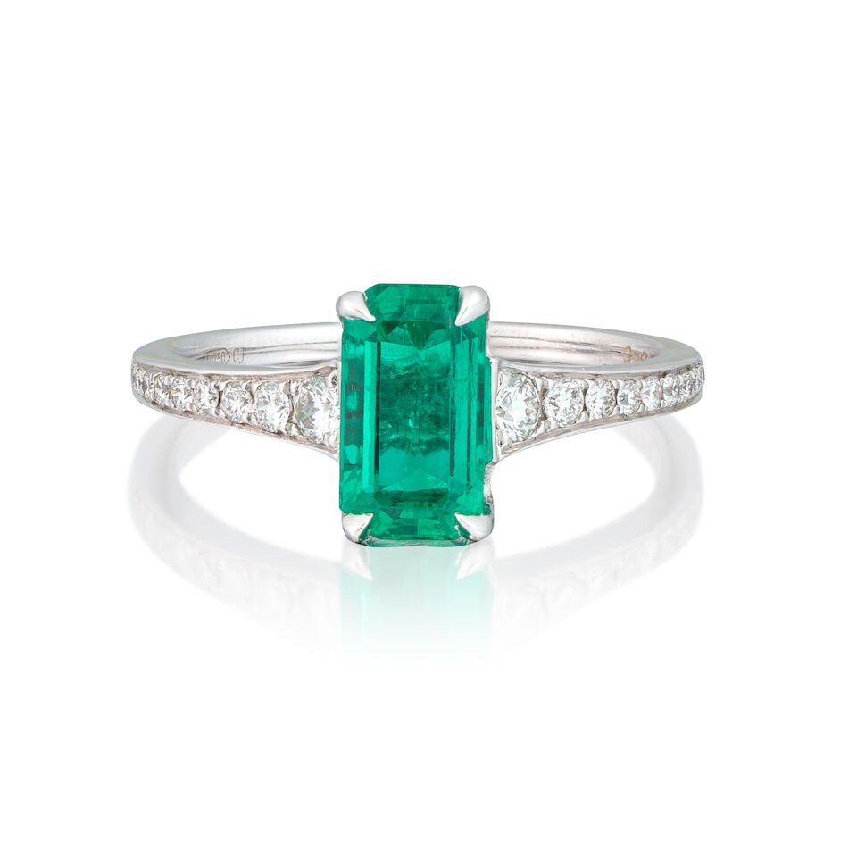 EMERALD AND DIAMOND RING: EMERALD AND DIAMOND RING Octagonal step-cut emerald 1.42 carats Brilliant-cut diamonds Ring size approx. M½ Weight approx. 2.5g Footnotes: GCS: Natural Emerald, minor amount of oil in fissures.