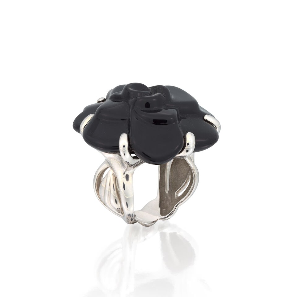 CHANEL: ONYX 'CAMELIA' RING: CHANEL: ONYX 'CAMELIA' RING Carved onyx Signed Chanel, numbered 6L956, French assay mark Ring size approx. L½ Weight approx. 21.5g Maker's case, pouch and box Footnotes: OVERALL CONDITION Light s