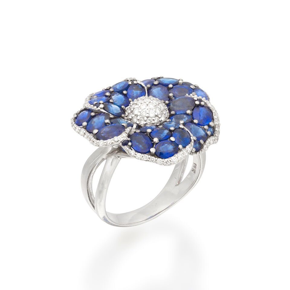 SAPPHIRE AND DIAMOND-SET FLOWER RING: SAPPHIRE AND DIAMOND-SET FLOWER RING Oval and circular-cut sapphires Brilliant-cut diamonds approx. 0.30ct total Ring size approx. Q½ Weight approx. 11.0g Footnotes: OVERALL CONDITION Light
