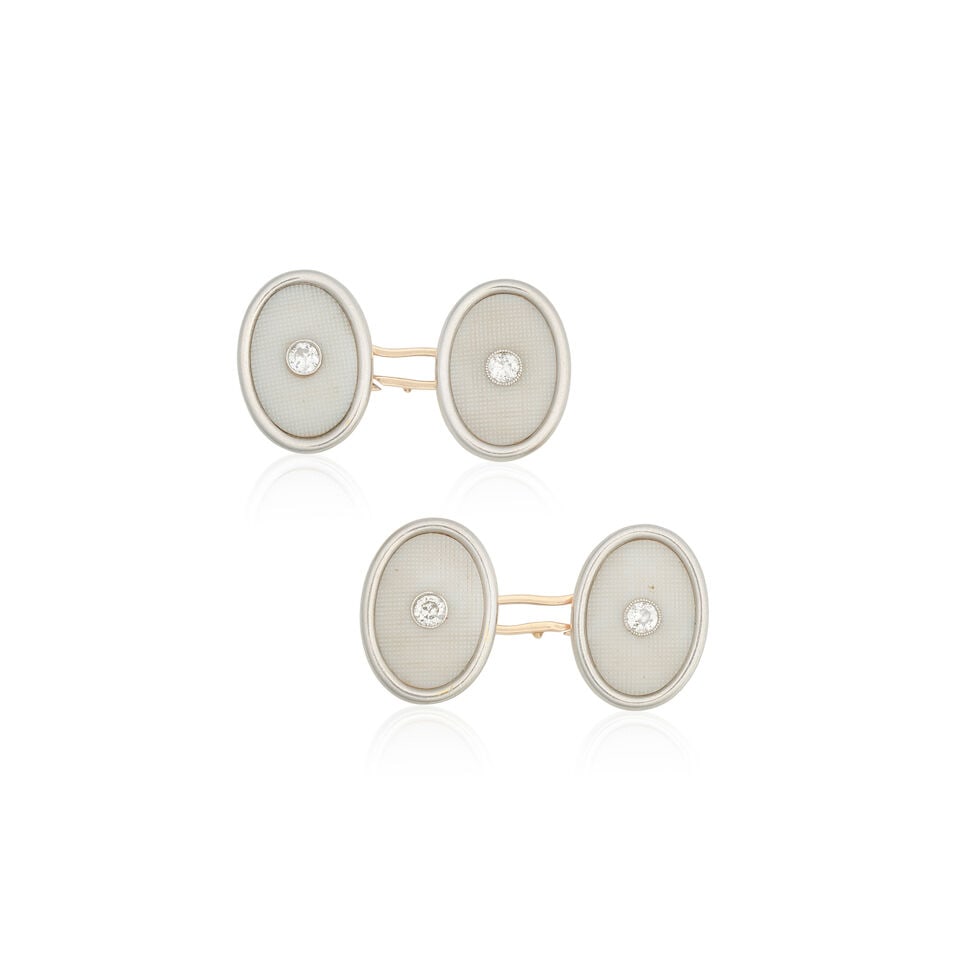 CARVED SHELL AND DIAMOND-SET CUFFLINKS: CARVED SHELL AND DIAMOND-SET CUFFLINKS Double-sided Carved shell Brilliant-cut diamonds Plaque length 1.6cm Weight approx. 9.0g Footnotes: Please note this lot is subject to CITES regulations when