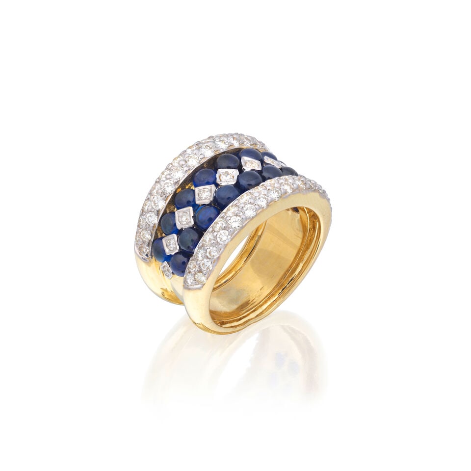 SAPPHIRE AND DIAMOND DRESS RING: SAPPHIRE AND DIAMOND DRESS RING Brilliant-cut diamonds approx. 0.65ct total Sapphire cabochons Ring size approx. O½ Weight approx. 13.5g Footnotes: OVERALL CONDITION Light surface wear to