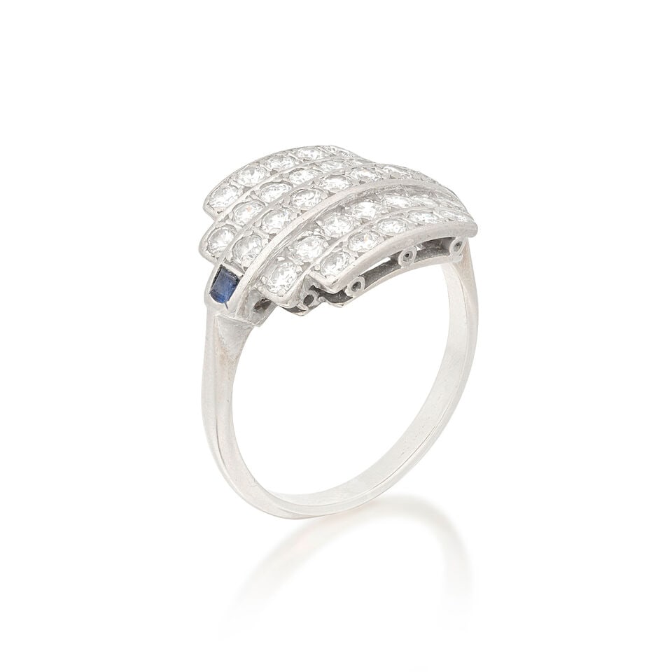 DIAMOND AND SAPPHIRE RING, 1995: DIAMOND AND SAPPHIRE RING, 1995 Brilliant-cut diamonds 1.20cts total Square-cut sapphires 18 carat gold UK hallmark Ring size approx. R Weight approx. 6.0g Footnotes: OVERALL CONDITION Some wear to