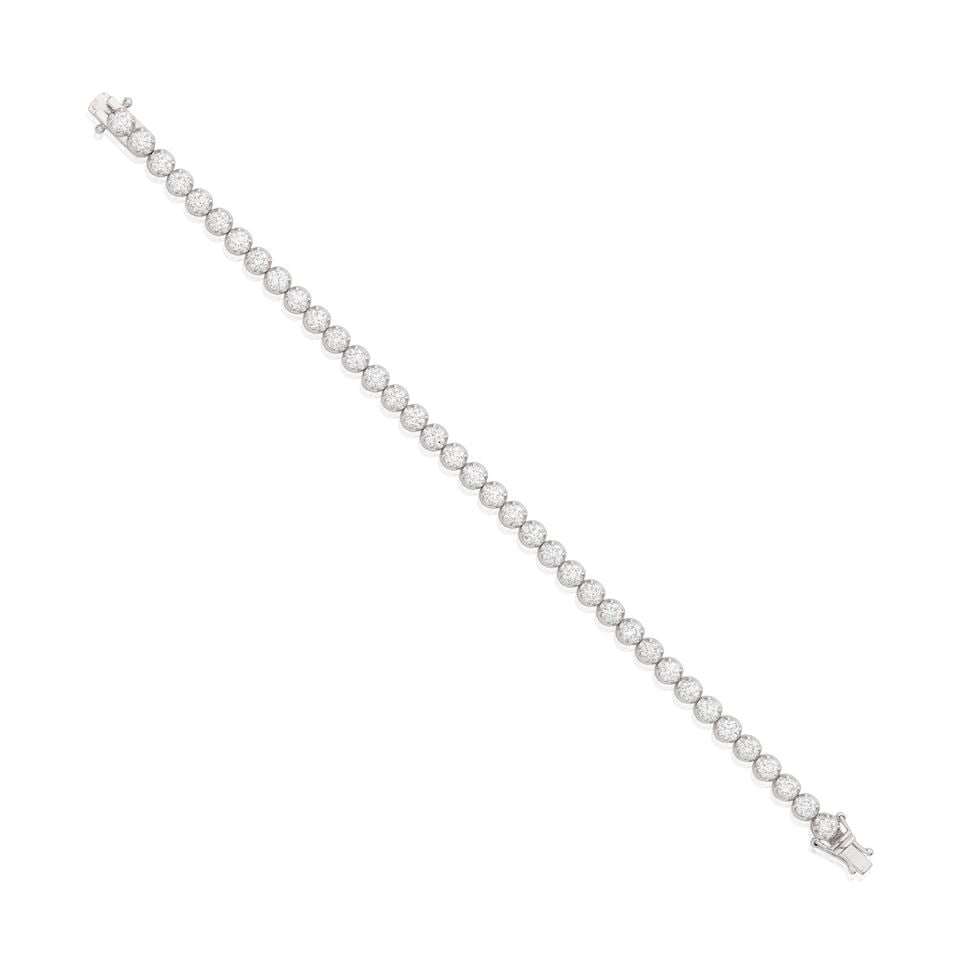 DIAMOND LINE BRACELET: DIAMOND LINE BRACELET Brilliant-cut diamonds approx. 5.50cts total Length 18.5cm Weight approx. 11.5g Footnotes: OVERALL CONDITION Light surface wear to unhallmarked metal stamped to clasp with 750. C