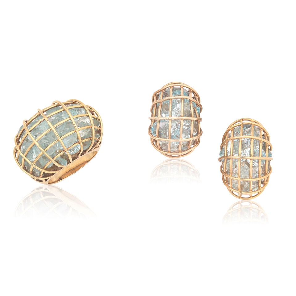 AQUAMARINE RING AND EARCLIP SUITE: AQUAMARINE RING AND EARCLIP SUITE Vari-cut aquamarine in cage design Ring size approx. L½ Earring length 2.3cm Weight approx. 43.5g total Footnotes: OVERALL CONDITION Some wear to unhallmarked