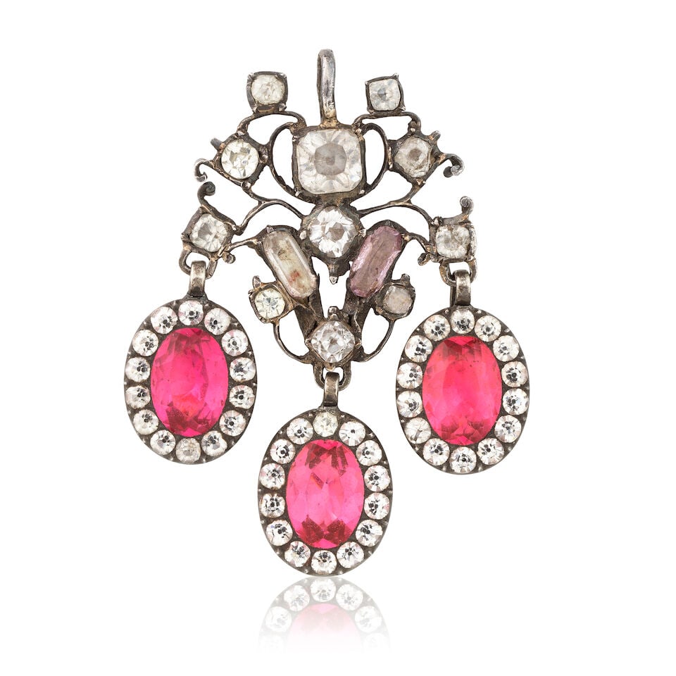 PASTE PENDANT: PASTE PENDANT Vari-cut colourless and pink paste Length 4.3cm Weight approx. 8.0g Footnotes: OVERALL CONDITION Visible wear to unhallmarked metal testing as silver. Three drops possible later