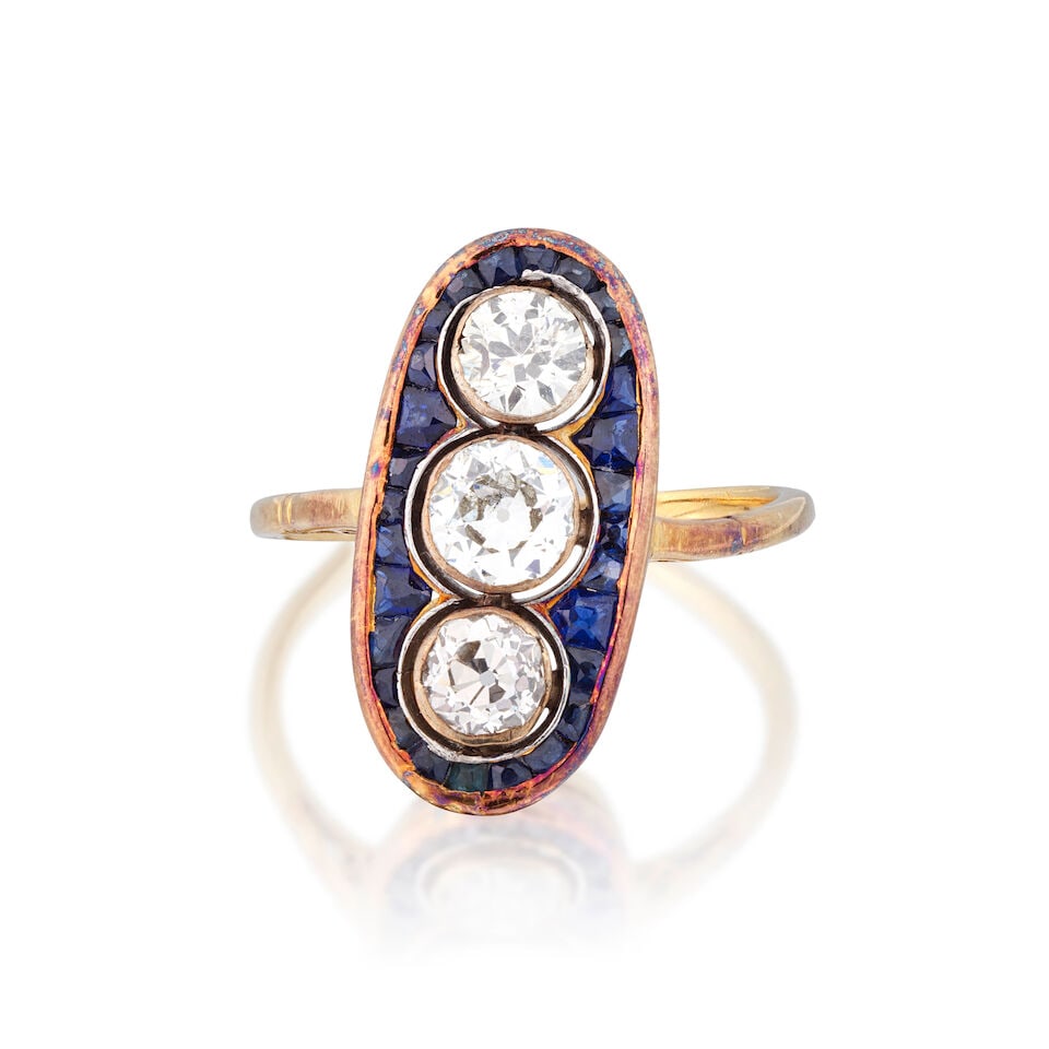 SAPPHIRE AND DIAMOND RING, EARLY 20TH CENTURY: SAPPHIRE AND DIAMOND RING, EARLY 20TH CENTURY Old brilliant-cut diamonds approx. 1.10cts total Calibré-cut sapphires Ring size approx. N½ Weight approx. 4.0g Footnotes: OVERALL