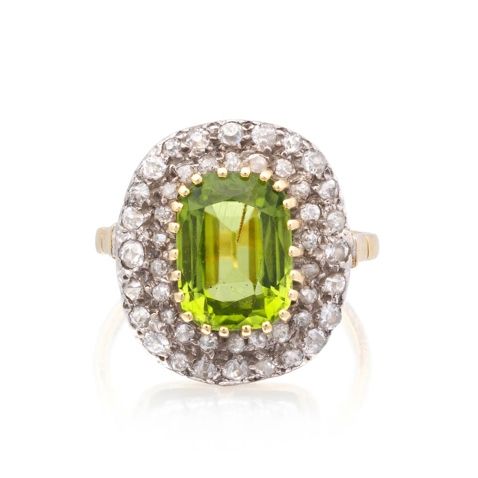 PERIDOT AND DIAMOND CLUSTER RING: PERIDOT AND DIAMOND CLUSTER RING Cushion-cut peridot Single-cut diamonds approx. 0.45ct total Ring size approx. N½ Weight approx. 5.5g Footnotes: OVERALL CONDITION Some surface wear to unhallmark