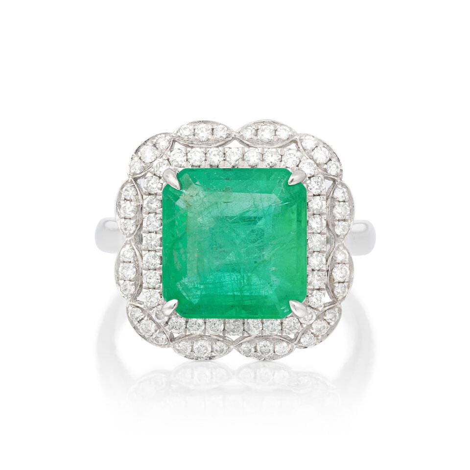 EMERALD AND DIAMOND RING: EMERALD AND DIAMOND RING Octagonal step-cut emerald Brilliant-cut diamonds approx. 0.40ct total Ring size approx. N Weight approx. 7.5g Footnotes: OVERALL CONDITION Negligible surface wear to unhallma