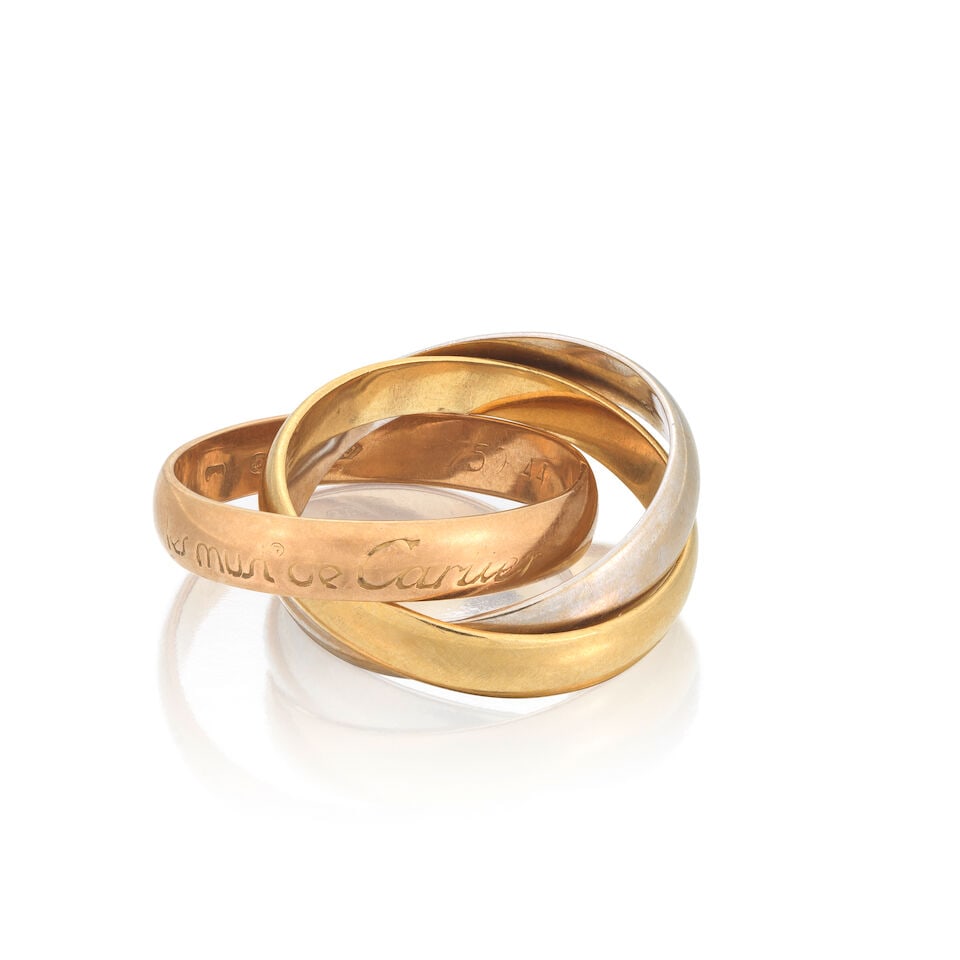 CARTIER: TRINITY RING: CARTIER: TRINITY RING 18 carat tri-coloured gold Signed Must de Cartier, Convention mark Ring size approx. F½ Weight approx. 5.0g Footnotes: OVERALL CONDITION Some wear to 18 carat gold signed