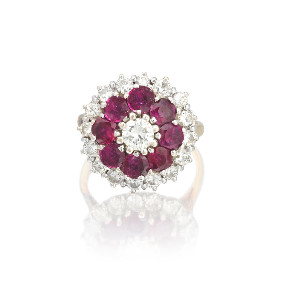 RUBY AND DIAMOND CLUSTER RING: RUBY AND DIAMOND CLUSTER RING Circular-cut rubies Brilliant-cut diamonds approx. 1.10cts total Ring size approx. M Weight approx. 7.0g Footnotes: OVERALL CONDITION Light surface wear to unhallmarked