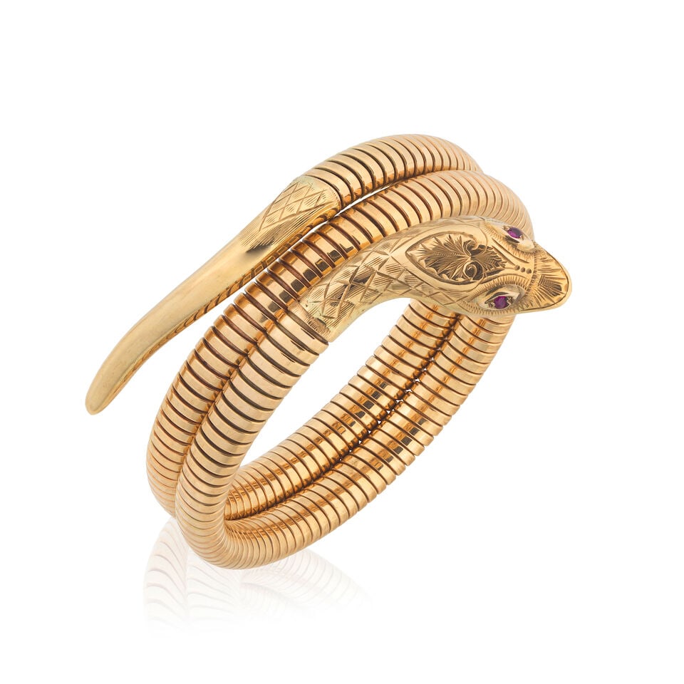 CROPP & FARR: GOLD AND GEM-SET SNAKE BRACELET, 1955: CROPP & FARR: GOLD AND GEM-SET SNAKE BRACELET, 1955 Of sprung tubogas design 9 carat gold Circular-cut rubies UK hallmark, maker's mark C&F Adjustable circumference Weight approx.