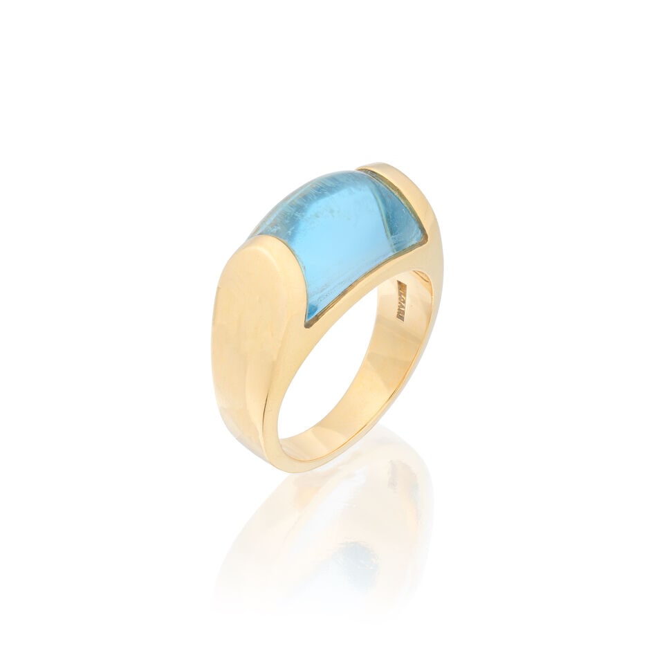 BULGARI: TOPAZ 'TRONCHETTO' RING: BULGARI: TOPAZ 'TRONCHETTO' RING Fancy-cut blue topaz 18 carat gold Signed Bulgari, Convention mark, Swiss assay mark Ring size approx. L½, plaque length 1.8cm Weight approx.