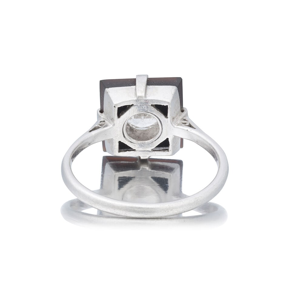 DIAMOND AND ONYX PLAQUE RING, CIRCA 1925 - 2