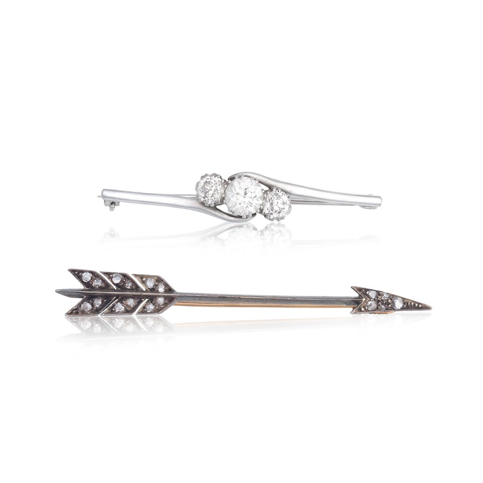 TWO DIAMOND-SET BAR BROOCHES: TWO DIAMOND-SET BAR BROOCHES 1st: Of arrow design Rose-cut diamonds Length 5.8cm Weight approx. 4.5g 2nd: Old brilliant-cut diamonds approx. 1.60cts total Length 4.3cm Weight approx.