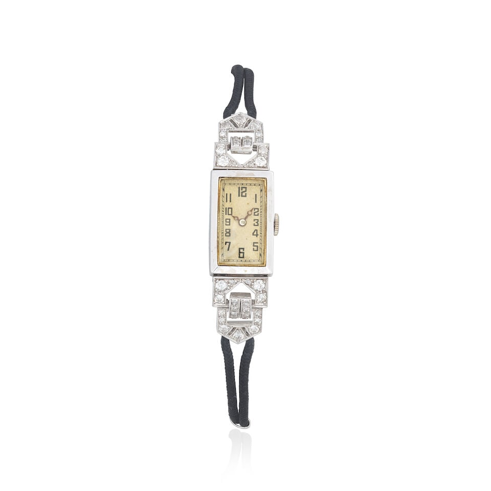 DIAMOND COCKTAIL WATCH, CIRCA 1930: DIAMOND COCKTAIL WATCH, CIRCA 1930 Old brilliant and single-cut diamonds approx. 1.10cts total Case length 2.2cm, plaque length 5.5cm Weight approx. 16.5g Footnotes: OVERALL CONDITION Some surface