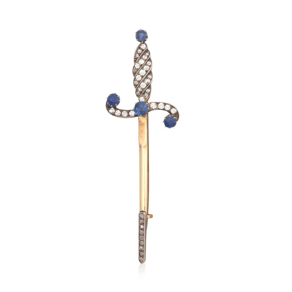 SAPPHIRE AND DIAMOND DAGGER BROOCH, CIRCA 1890: SAPPHIRE AND DIAMOND DAGGER BROOCH, CIRCA 1890 Cushion and circular-cut sapphires Old brilliant and rose-cut diamonds approx. 0.60ct total Mounted in silver and gold Length 7.5cm Weight approx.