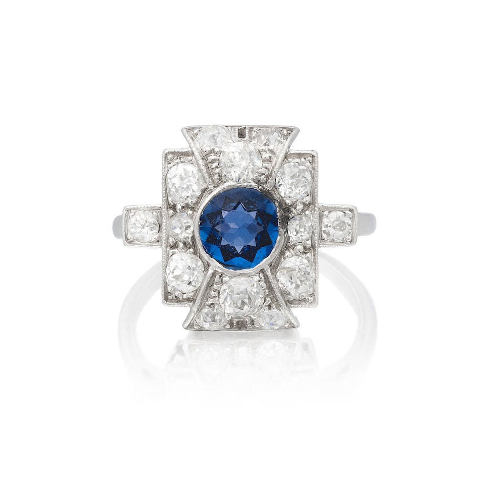 SAPPHIRE AND DIAMOND RING, CIRCA 1930: SAPPHIRE AND DIAMOND RING, CIRCA 1930 Circular-cut sapphire Old brilliant-cut diamonds approx. 0.70ct total Ring size approx. M Weight approx. 5.0g Footnotes: OVERALL CONDITION Some wear to