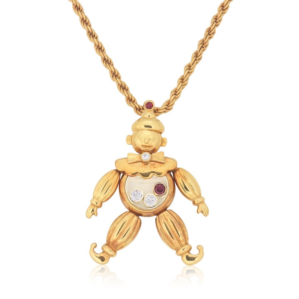 CHOPARD: DIAMOND AND RUBY 'HAPPY DIAMONDS' CLOWN PENDANT/NECKLACE: CHOPARD: DIAMOND AND RUBY 'HAPPY DIAMONDS' CLOWN PENDANT/NECKLACE Brilliant-cut diamonds Circular-cut rubies Signed Chopard Pendant length 3.0cm, necklace length 42.0cm Weight approx. 16.0g Maker's