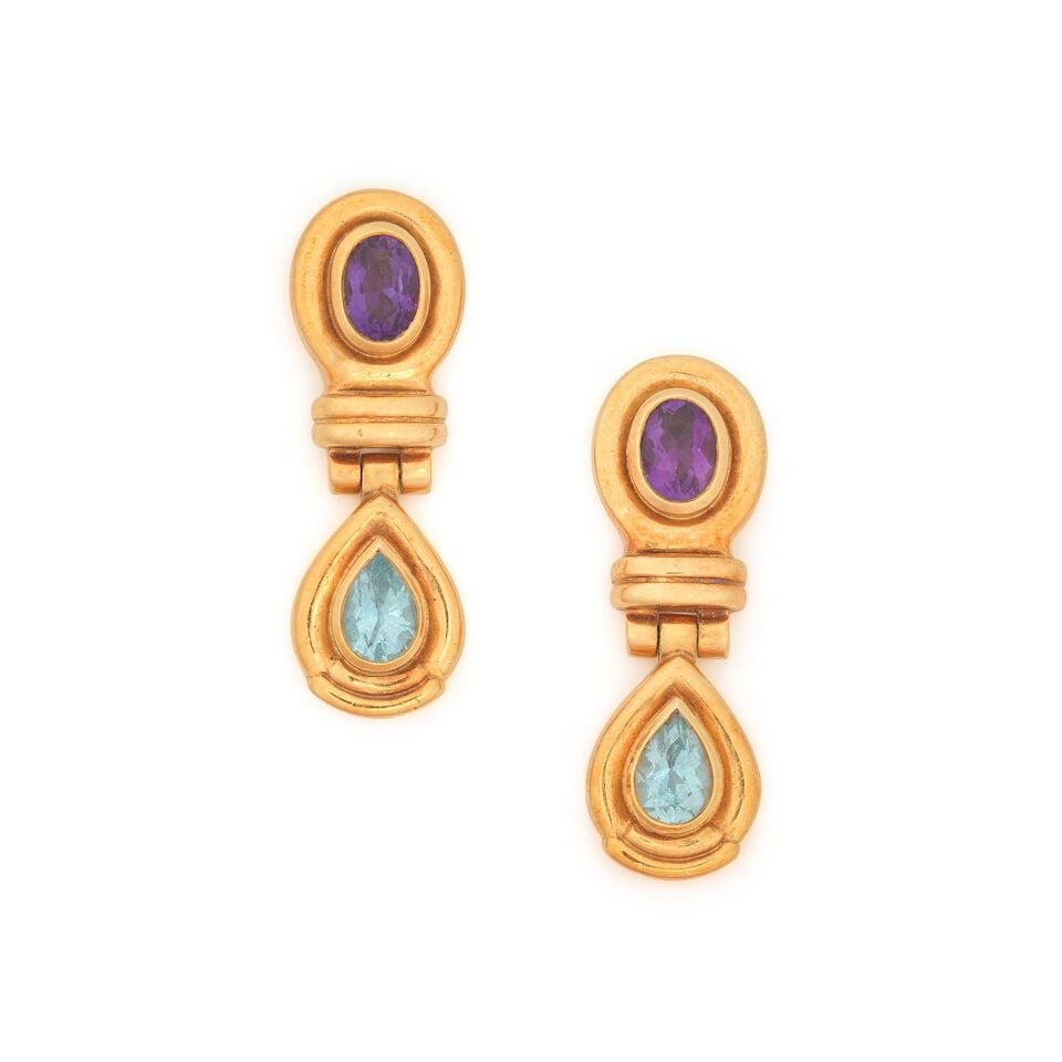 THEO FENNELL: AQUAMARINE AND AMETHYST PENDENT EARRINGS, 1990: THEO FENNELL: AQUAMARINE AND AMETHYST PENDENT EARRINGS, 1990 Oval-cut amethyst Pear-cut aquamarine 18 carat gold Signed Fennell, maker's mark TF, London hallmarks Length 3.0cm Weight approx. 14.0g Mak