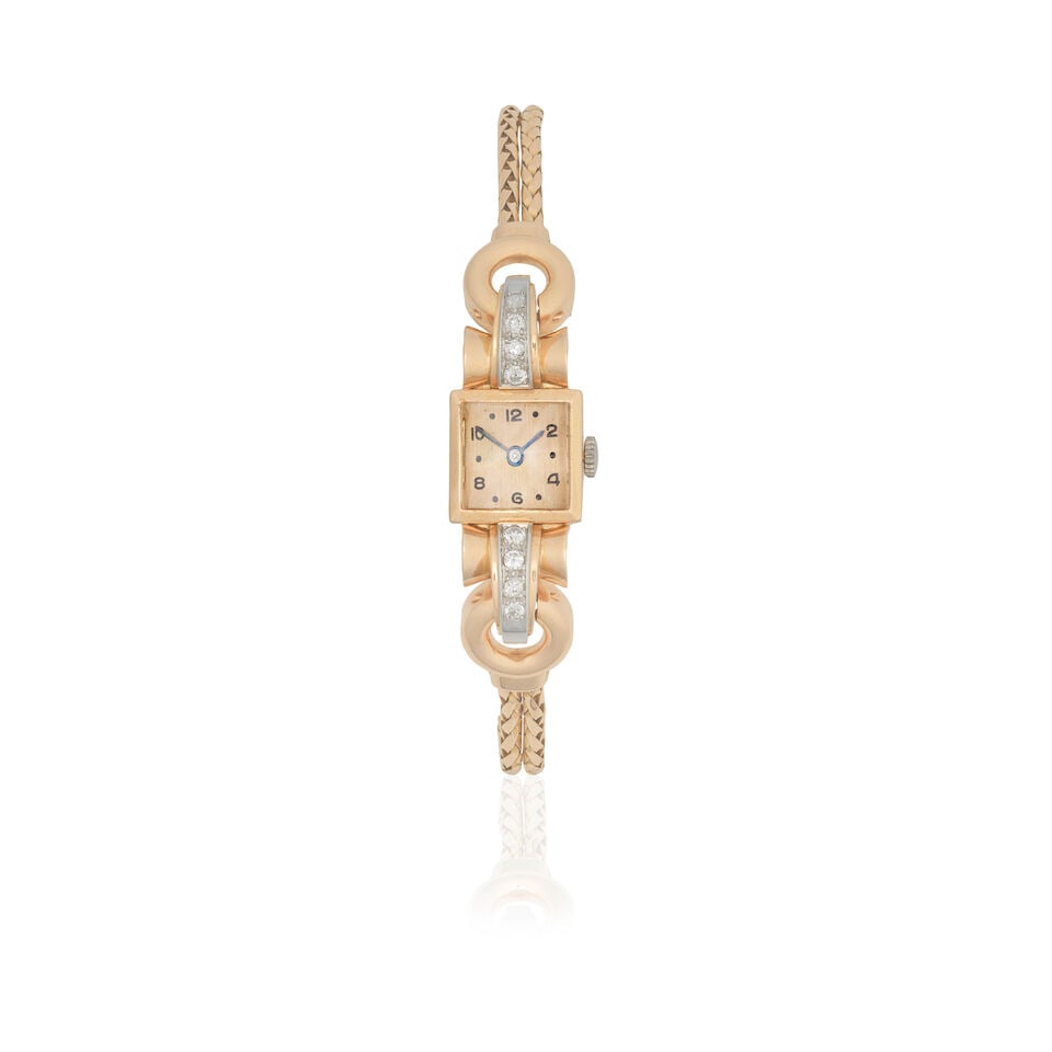 DIAMOND-SET COCKTAIL WATCH, CIRCA 1940: DIAMOND-SET COCKTAIL WATCH, CIRCA 1940 Old brilliant-cut diamonds approx. 0.70ct total Length 18.0cm Weight approx. 42.0g Footnotes: OVERALL CONDITION Some light wear to unhallmarked yellow metal with