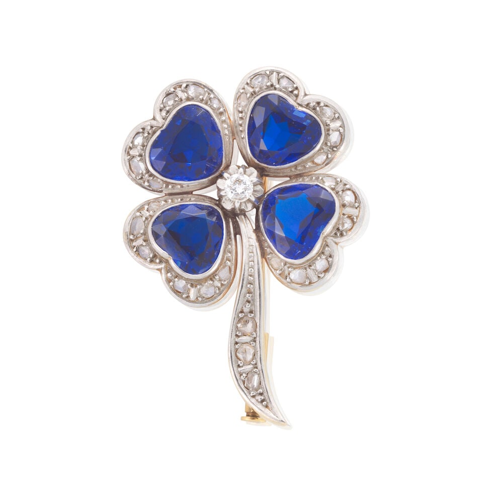 SYNETHETIC SPINEL AND DIAMOND BROOCH: SYNETHETIC SPINEL AND DIAMOND BROOCH Heart-shaped blue synthetic spinels Rose-cut diamonds Length 4.0cm Weight approx. 10.5g Footnotes: OVERALL CONDITION Some light surface wear to unhallmarked metal,