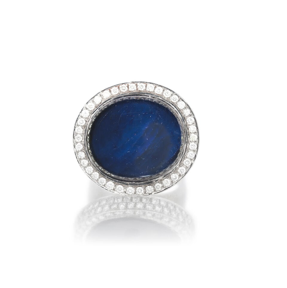 SAPPHIRE AND DIAMOND RING: SAPPHIRE AND DIAMOND RING Sapphire cabochon Brilliant-cut diamonds approx. 2.40cts total Ring size approx. R½ Weight approx. 25.5g Footnotes: OVERALL CONDITION Some surface wear to unhallmarked