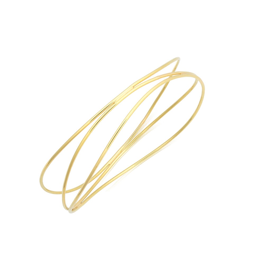 ELSA PERETTI FOR TIFFANY: GOLD 'WAVE' BANGLE: ELSA PERETTI FOR TIFFANY: GOLD 'WAVE' BANGLE 18 carat gold Signed T&Co. Elsa Peretti, Convention mark, Dutch assay mark Inner circumference 21.3cm Weight approx. 12.5g Maker's case, box and pouch Foot
