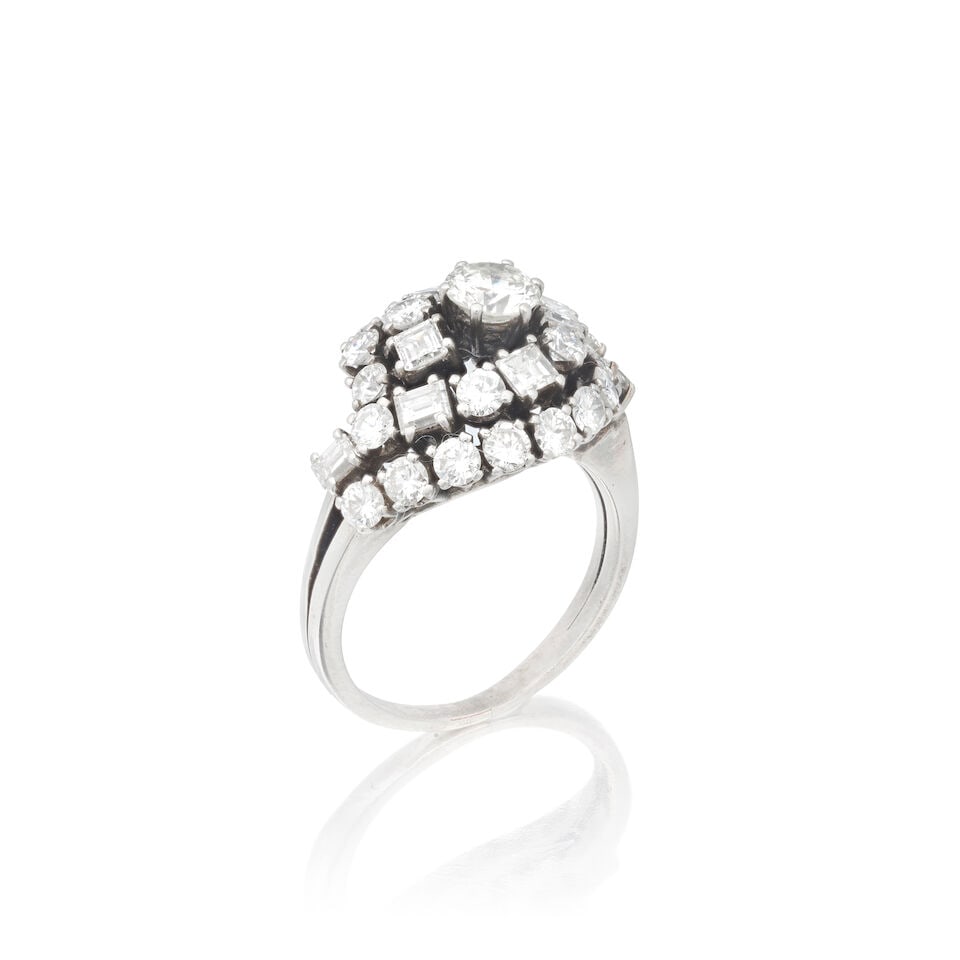 DIAMOND RING: DIAMOND RING Brilliant and step-cut diamonds approx. 1.10cts total Ring size approx. L Weight approx. 7.5g Footnotes: OVERALL CONDITION Light surface wear to unhallmarked white metal testing as