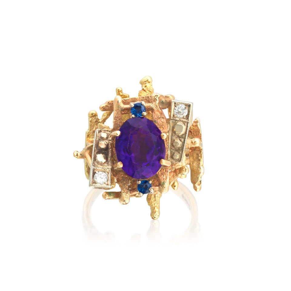 ROY KING: AMETHYST, SAPPHIRE AND DIAMOND RING, 1971: ROY KING: AMETHYST, SAPPHIRE AND DIAMOND RING, 1971 Oval-cut amethyst Circular-cut sapphires Brilliant-cut diamonds 18 carat gold London hallmark Ring size approx. O Weight approx. 9.0g Footnotes: OVE
