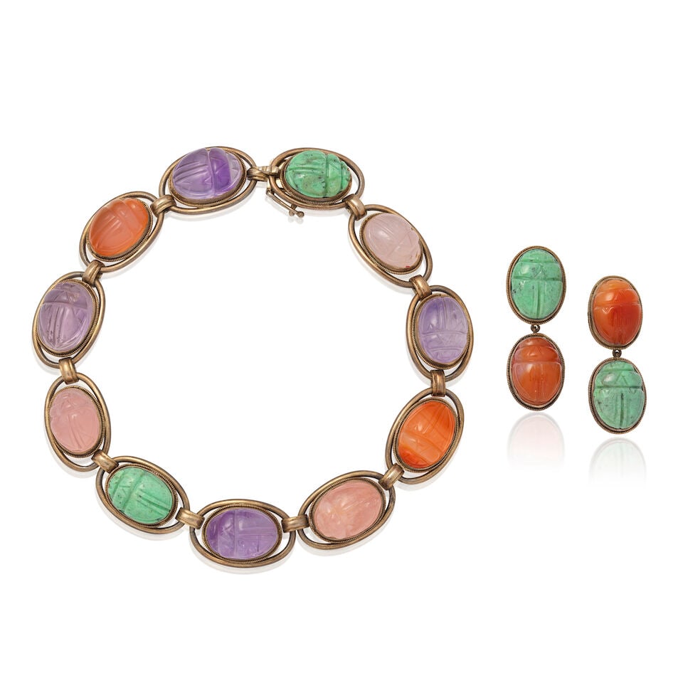 CARVED SCARAB QUARTZ NECKLACE AND EARCLIP SUITE: CARVED SCARAB QUARTZ NECKLACE AND EARCLIP SUITE Carved quartz Mounted in base metal Lengths: necklace 33.8cm, earrings 4.3cm Weight approx. 108.0g Footnotes: OVERALL CONDITION Surface wear