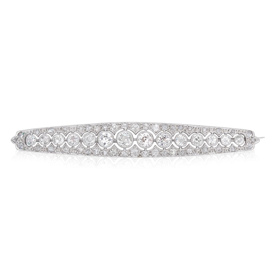 DIAMOND BAR BROOCH, CIRCA 1915: DIAMOND BAR BROOCH, CIRCA 1915 Old brilliant, single and rose-cut diamonds approx. 1.75cts total Length 6.0cm Weight approx. 6.0g Footnotes: OVERALL CONDITION Light surface wear to unhallmarked white 
