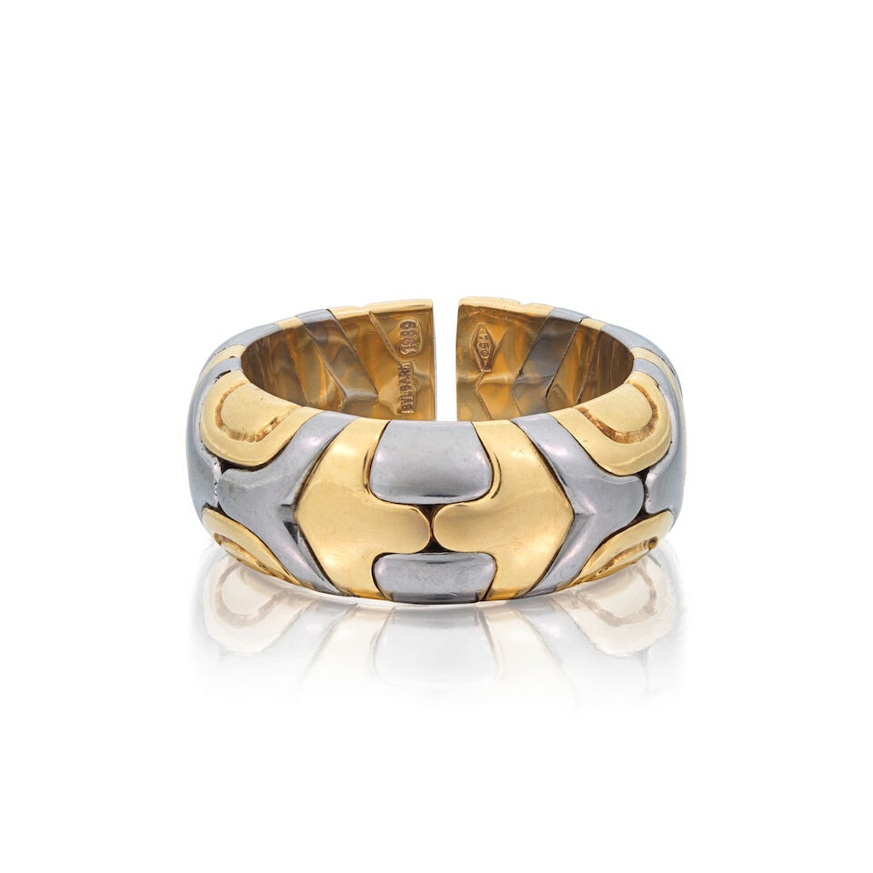 BULGARI: BI-COLOURED 'ALVEARE' RING: BULGARI: BI-COLOURED 'ALVEARE' RING Signed Bulgari Ring size approx. N (leading edge) Weight approx. 10.0g Footnotes: OVERALL CONDITION Light surface wear to unhallmarked bi-coloured metal, signed