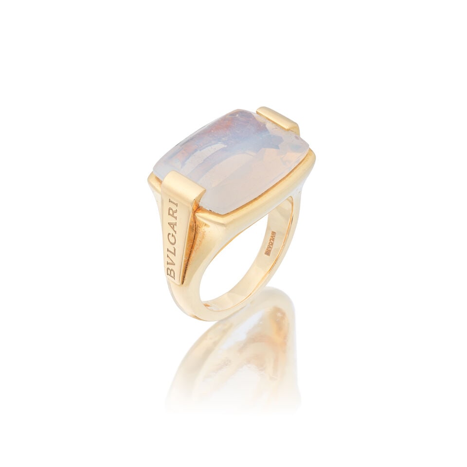 BULGARI: MOONSTONE 'METROPOLIS' RING: BULGARI: MOONSTONE 'METROPOLIS' RING Fancy-cut moonstone Signed Bulgari, Swiss assay mark Ring size approx. K, plaque length 1.9cm Weight approx. 12.5g Maker's pouch Footnotes: OVERALL CONDITION Light