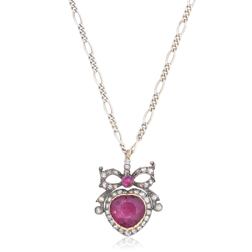 RUBY AND DIAMOND-SET PENDANT: RUBY AND DIAMOND-SET PENDANT Heart-shaped ruby and ruby cabochon Rose-cut diamonds Length 2.7cm Weight approx. 6.0g Footnotes: OVERALL CONDITION Some surface wear to unhallmarked metal pendant